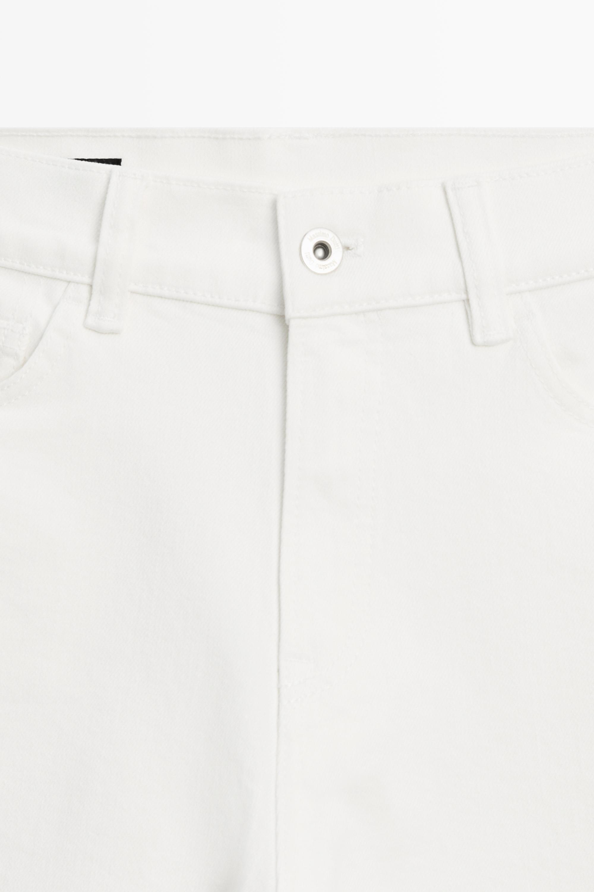 Jean capri taille moyenne retroussé